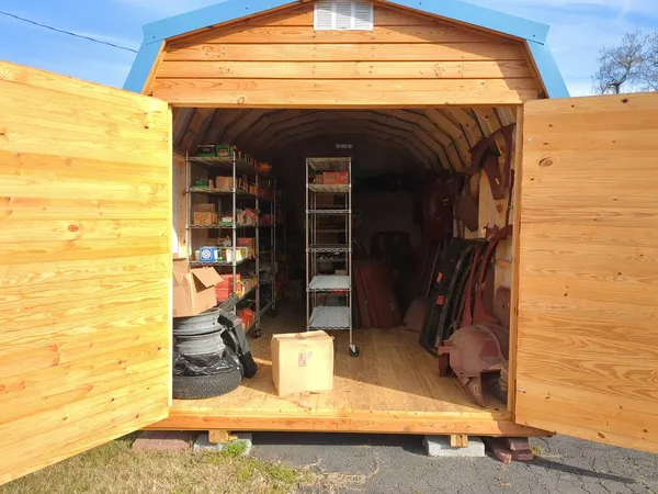 Storage building with many classic car parts